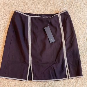 Small black skirt with rhinestone outlining